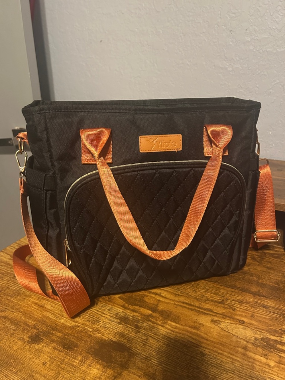 Quilted Black Insulated Bag with Orange Accents -